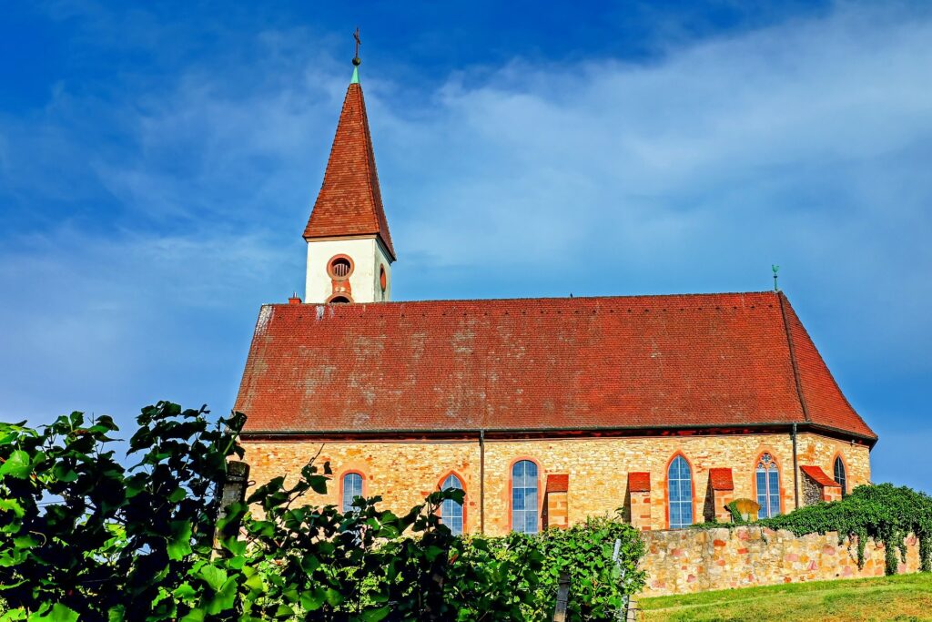 A church building built near a pleasant hill with good growth